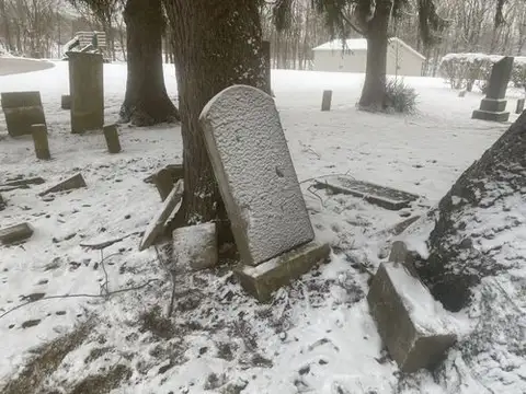Winter's quiet embrace settles softly on ancient stones.